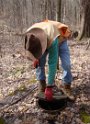 Charlie opening the cover to an underground storage tank.