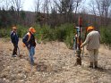 Examining an active gas well for leaks.