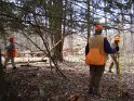 Marking a well site with flagging tape.
